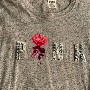 Shirt from pink with a rose in the middle